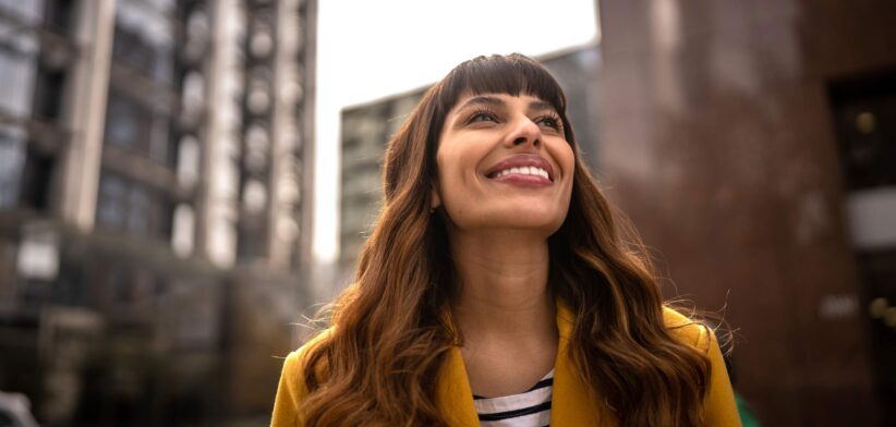 Happy woman in city. | Newsreel