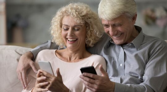 Elderly couple on mobile phones. | Newsreel