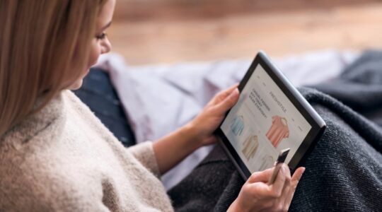 Woman shopping for clothes online. | Newsreel
