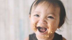 Baby with peanut butter on face. | Newsreel