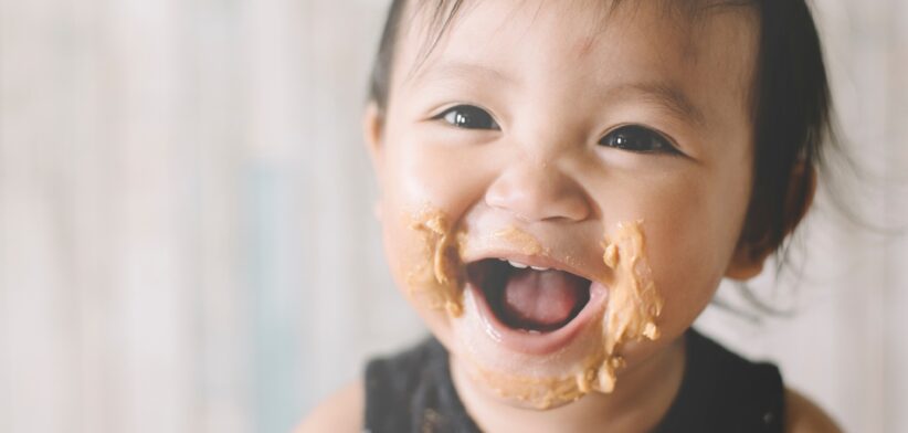 Baby with peanut butter on face. | Newsreel