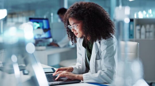 Researcher on computer. | Newsreel