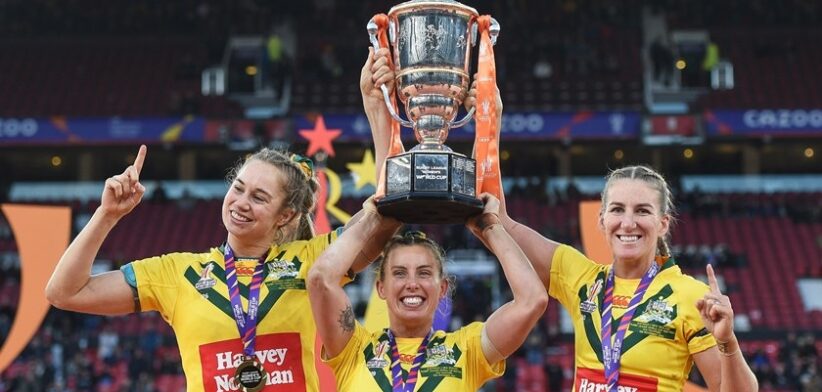 Jillaroos co-captains Kezie Apps, Sam Bremner and Ali Brigginshaw celebrate after winning the World Cup at Old Trafford in 2022.