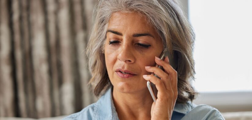 Woman with credit card on phone. | Newsreel