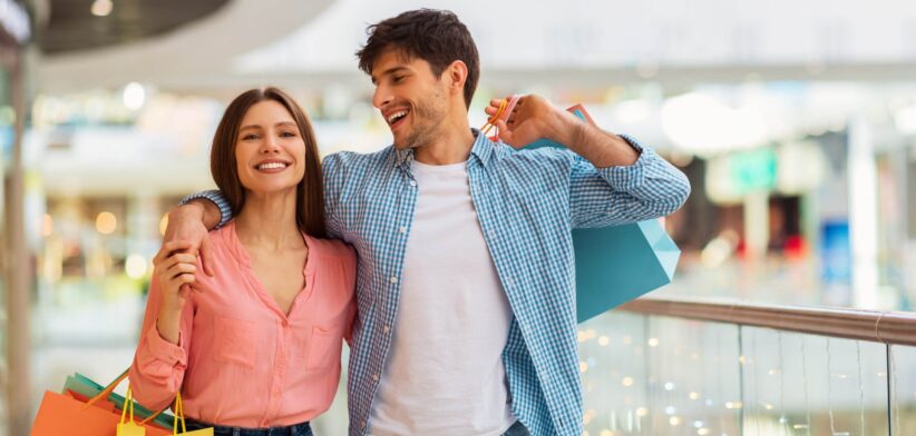 Man and woman shopping at shopping centre. | Newsreel