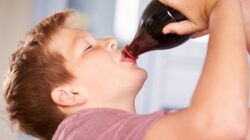 Boy drinking a soft drink. | Newsreel