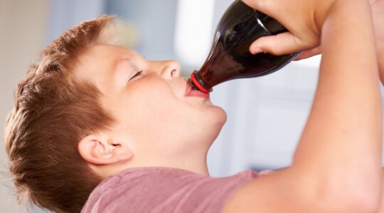 Boy drinking a soft drink. | Newsreel