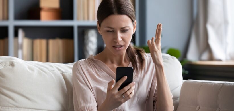 Woman having problems with mobile phone. | Newsreel