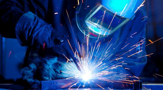 Person welding with sparks. | Newsreel