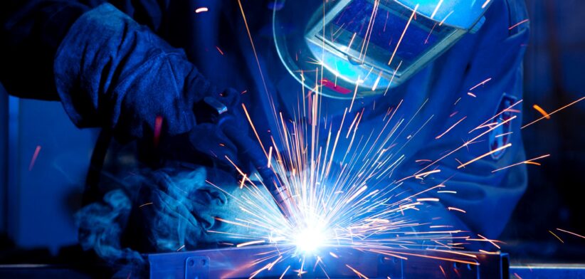 Person welding with sparks. | Newsreel