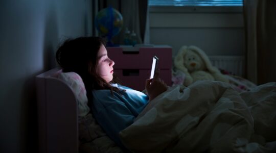 Young person on mobile phone. | Newsreel