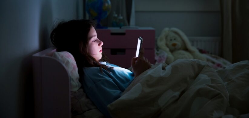 Young person on mobile phone. | Newsreel