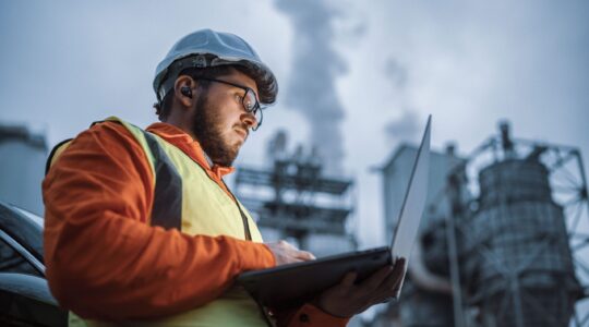 Engineer with laptop. | Newsreel