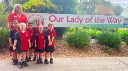 Our Lady of the Way School Petrie principal Aleisha Connellan with students. | Newsreel