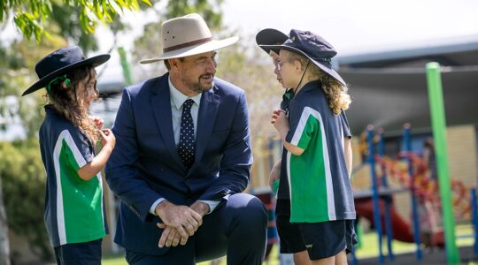 Unity College Caloundra West principal Brett Jones and students. | Newsreel