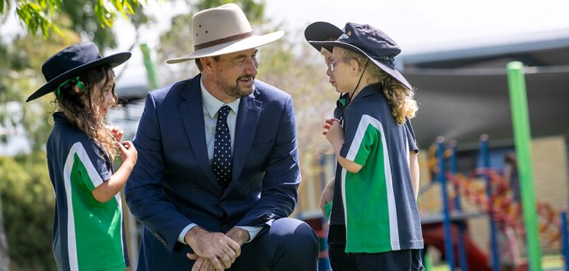 Unity College Caloundra West principal Brett Jones and students. | Newsreel