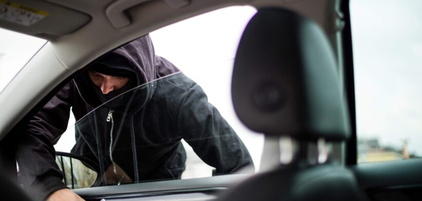 Man breaking into car. | Newsreel