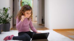 Child watching content on a computer. | Newsreel