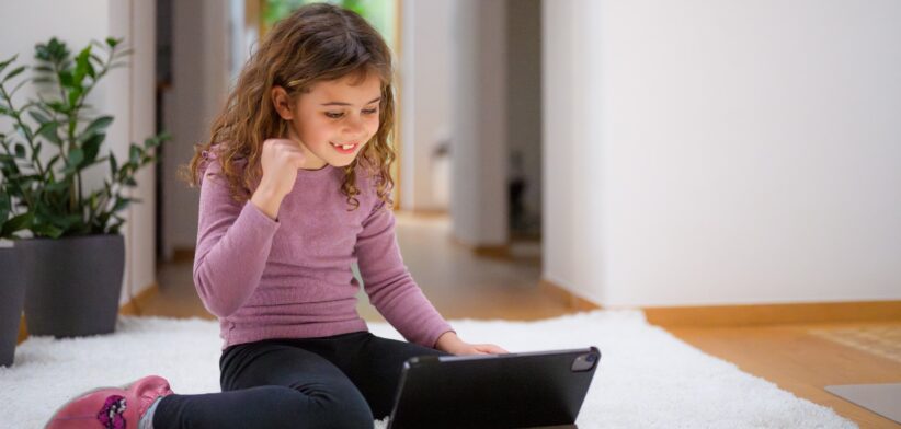 Child watching content on a computer. | Newsreel