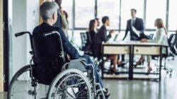 Worker in wheelchair excluded from meeting. | Newsreel