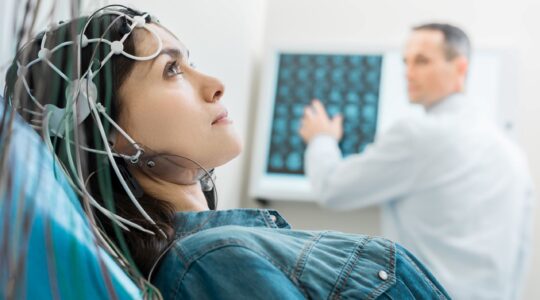 Woman undergoing an EEG. | Newsreel