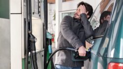 Man filling up car with petrol. | Newsreel