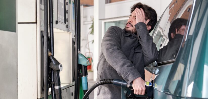 Man filling up car with petrol. | Newsreel