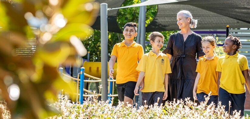 St Paul's School Woodridge Helen Boyes with students. | Newsreel