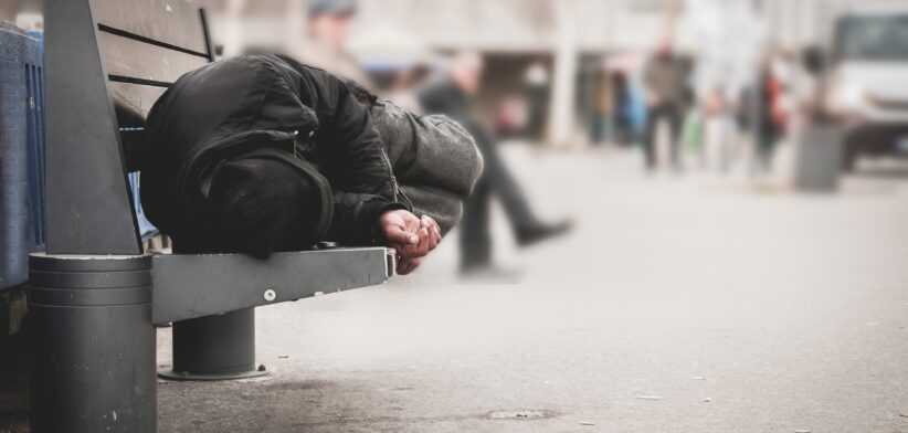 Homeless person on park bench. | Newsreel