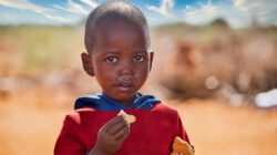 Young African child eating. | Newsreel