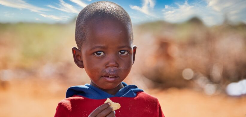 Young African child eating. | Newsreel