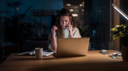 Woman working late at night. | Newsreel