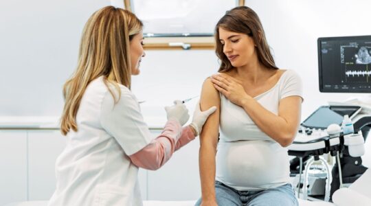 Pregnant woman getting an injection. | Newsreel