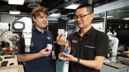 Dr Fangyi Zang, right, and research assistant Maceon Knopke from QUT . | Newsreel