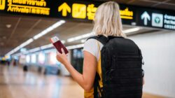 Female traveller at airport. | Newsreel