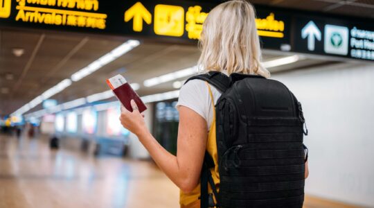 Female traveller at airport. | Newsreel