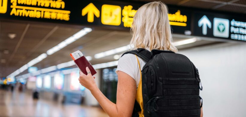 Female traveller at airport. | Newsreel