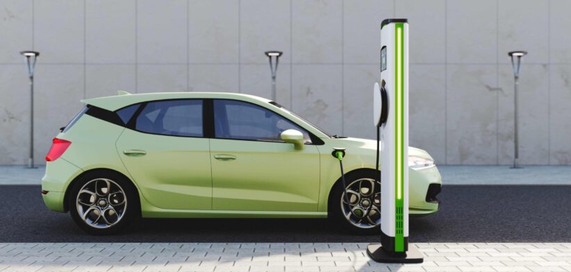 Electric vehicle at charging station. | Newsreel