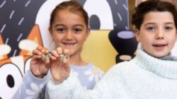 Children with Bluey dollar coins.