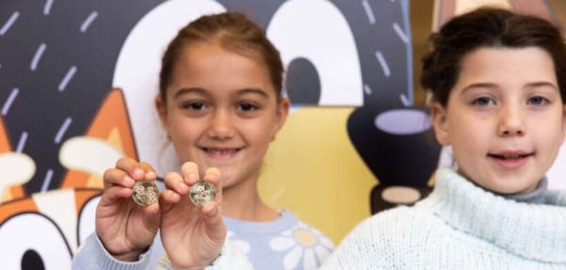 Children with Bluey dollar coins.