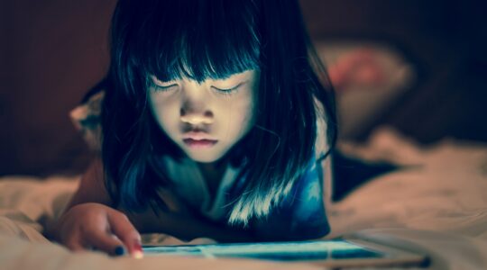 Young child on tablet computer. | Newsreel