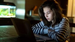 Child looking at computer. | Newsreel