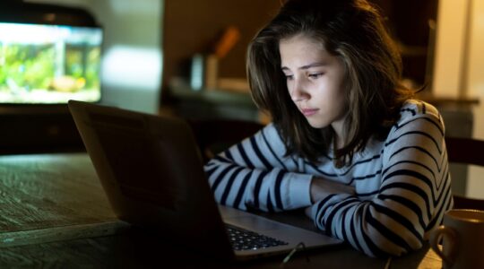 Child looking at computer. | Newsreel