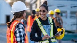 Two women on a construction site. | Newsreel