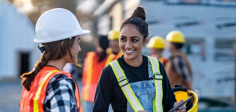 Two women on a construction site. | Newsreel