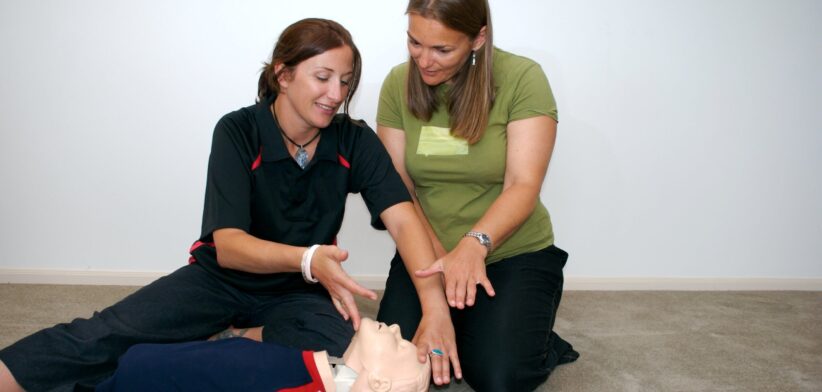 Teacher and student in first aid course. | Newsreel