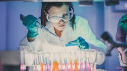 Scientist testing in lab. | Newsreel