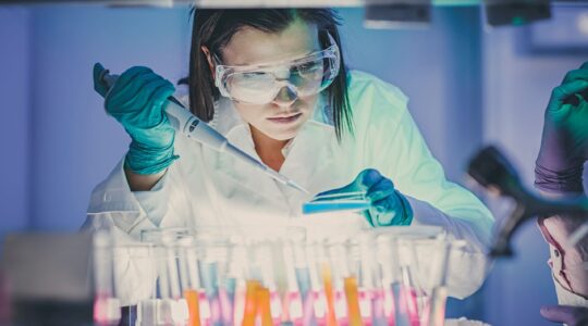 Scientist testing in lab. | Newsreel