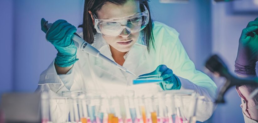 Scientist testing in lab. | Newsreel