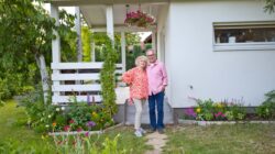 Elderly couple outside home. | Newsreel